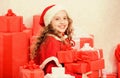 Unpacking christmas gift. Kid excited about opening christmas present. Girl celebrate christmas. Kid helping santa. New Royalty Free Stock Photo