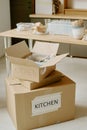 Unpacking Kitchen Boxes While Moving into New Home Royalty Free Stock Photo