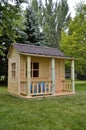 Unpainted backyard playhouse Royalty Free Stock Photo