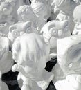 Unpainted white plaster cartoon doll