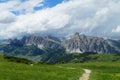 Unparved mountain road in green valley Royalty Free Stock Photo