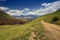 Unpaved county roads towards Rocky Mountains Range in Colorado, USA Royalty Free Stock Photo