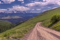 Unpaved county roads towards Rocky Mountains Range in Colorado, USA Royalty Free Stock Photo