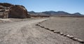 Unpaved road near Ancient Petroglyphs on the Rocks at Yerbas Buenas in Atacama Desert in Chile