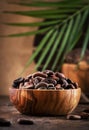 Unpeeled cocoa bean on wooden rustic background, close-up. Copy space Royalty Free Stock Photo