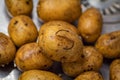 Potatoes in the sink, fresh washed with water. Potato with sign. Superpotato.