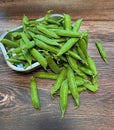 unpeeled peas in shell, summer harvest of beans, green sugar peas, natural vitamins, vegetables on a wooden background Royalty Free Stock Photo