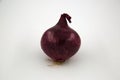 Unpeeled Whole red Onion Close-up