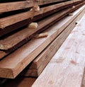 Unplaned thick planks covered with antiseptic preparation Royalty Free Stock Photo