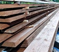 Unplaned thick planks covered with antiseptic preparation Royalty Free Stock Photo