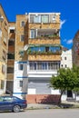 unplastered housing building with visible bricks in the city of VlorÃÂ«, Albania.