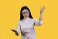 Unpleasant young asian businesswoman is explaining something. Royalty Free Stock Photo