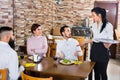 Unpleased client talking with manager in restaurant