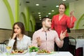 Unpleased couple in restaurant