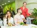 Unpleased couple in restaurant