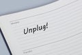 Unplug reminder message in an open diary