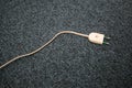 Unpluged lamp cable on the carpet floor. Old lamp cable Royalty Free Stock Photo