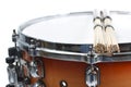 Unplugged drumsticks resting on a snare drum