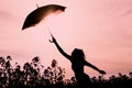 Unplugged silhouette woman with red umbrella and wanderlust Royalty Free Stock Photo