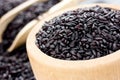 Unpolished black rice in a wooden bowl Royalty Free Stock Photo