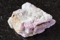 Unpolished pink Tourmaline in feldspar on black Royalty Free Stock Photo