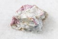 Unpolished pink Tourmaline in feldspar on white Royalty Free Stock Photo