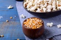 Unpopped corn kernels for making popcorn in a wooden cup Royalty Free Stock Photo