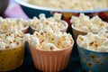 unpopped popcorn bowls on a shared table Royalty Free Stock Photo