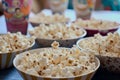 unpopped popcorn bowls on a shared table Royalty Free Stock Photo
