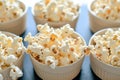 unpopped popcorn bowls on a shared table Royalty Free Stock Photo