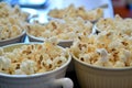 unpopped popcorn bowls on a shared table Royalty Free Stock Photo