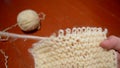 Unraveling the fabric knitted with woolen threads