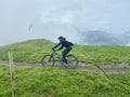 Unrecognicable biker on a mountainbike trail in Saalbach-Hinterglemm in the Austrian Alps in summer