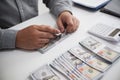 Unrecognisable businessman, accountant, banker counting money at the workplace, white background. Royalty Free Stock Photo