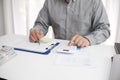 Unrecognisable businessman, accountant, banker counting money at the workplace, white background Royalty Free Stock Photo