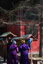 Unrecognisable Mongolian people turning prayer mills in Vajradhara Temple, Gandan Monastery, Ulan-Bator, Mongolia