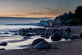 Unrecognisable people celebrating summer solstice with bonfires on beach