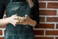 Unrecognisable woman making ceramic bowl in hand. Creative hobby concept. Earn extra money, side hustle, turning hobbies into cash