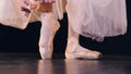 Unrecognised ballerina putting on pointer shoes. Close-up. HD.