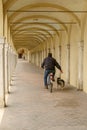 Riding under santa Maria covered walkway on Mazzini street, Coma