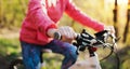 Unrecognizable active senior woman cycling outdoors in nature.