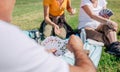 Unrecognizable adult family playing cards during an excursion Royalty Free Stock Photo