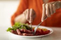 Unrecognizable african american woman eating tasty lunch in kitchen Royalty Free Stock Photo