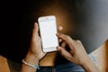 Unrecognizable Afro American man relaxing at cafe, sitting at the table, reading message on smart phone with white blank Royalty Free Stock Photo