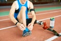 Handicapped Sportsman Tying Shoe Laces