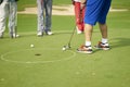 Unrecognizable asian man putting on green in golf course Royalty Free Stock Photo