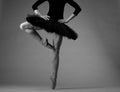 Unrecognizable ballerina in studio, black tutu outfit. classical ballet art. grayscale image Royalty Free Stock Photo