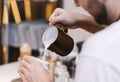 Unrecognizable Barista Making Cappuccino Adding Milk In Cup In Cafeteria Royalty Free Stock Photo