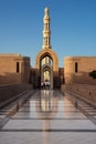 Unrecognizable believers enter the Great Mosque of Muscat