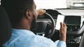 Unrecognizable Black Driver Using Mobile Phone Sitting In Automobile, Mockup